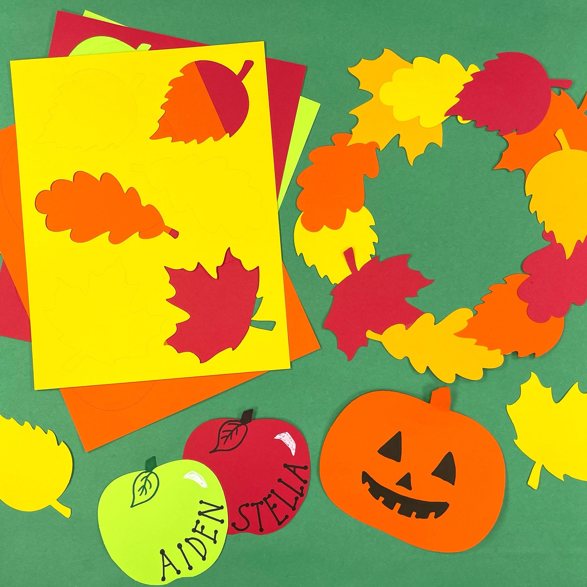 DIY fall crafts with pumpkin, apple, and leaf cutouts—ideal for crafting pumpkin art projects and fall decorations.