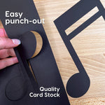 Music symbols and shapes—black cutouts of musical notes and symbols for craft projects, learning music notation, and decorating music sheets.