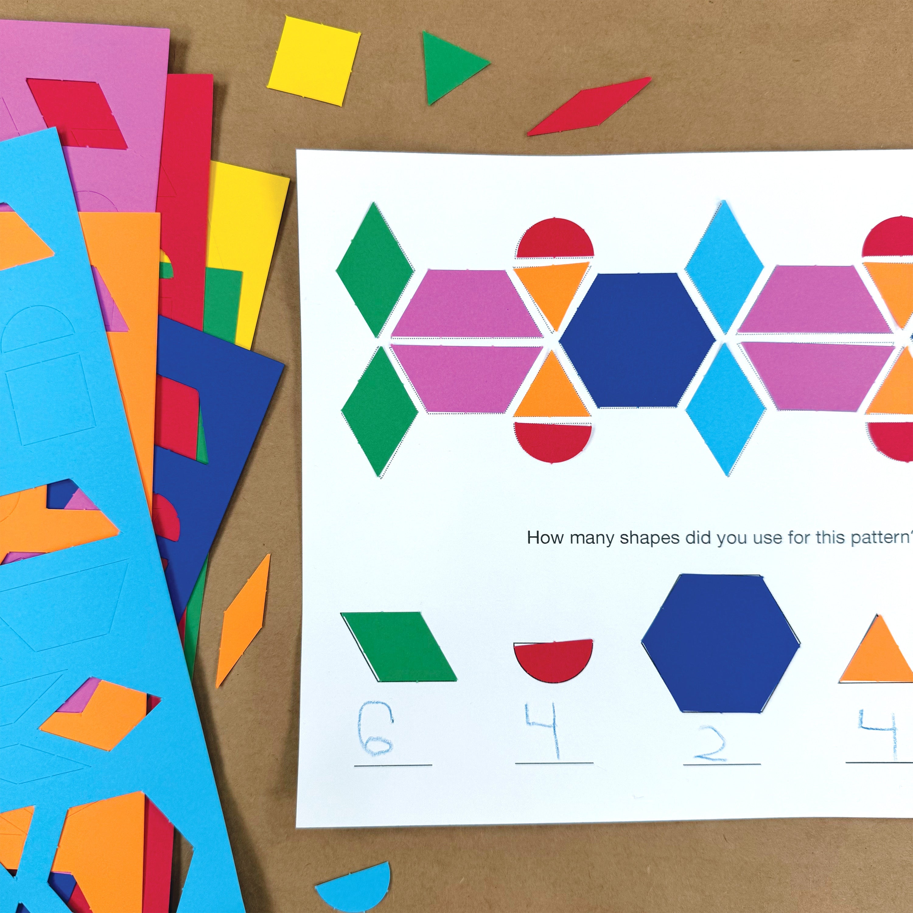 Learning shapes with pattern blocks—882 pieces of colorful paper shapes, perfect for developing fine motor skills and creating fun block crafts.