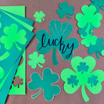 St. Patrick's Day decorations—shamrock cutouts ideal for spring crafts, St. Patrick's Day bulletin boards, and festive DIY activities.