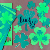St. Patrick's Day decorations—shamrock cutouts ideal for spring crafts, St. Patrick's Day bulletin boards, and festive DIY activities.