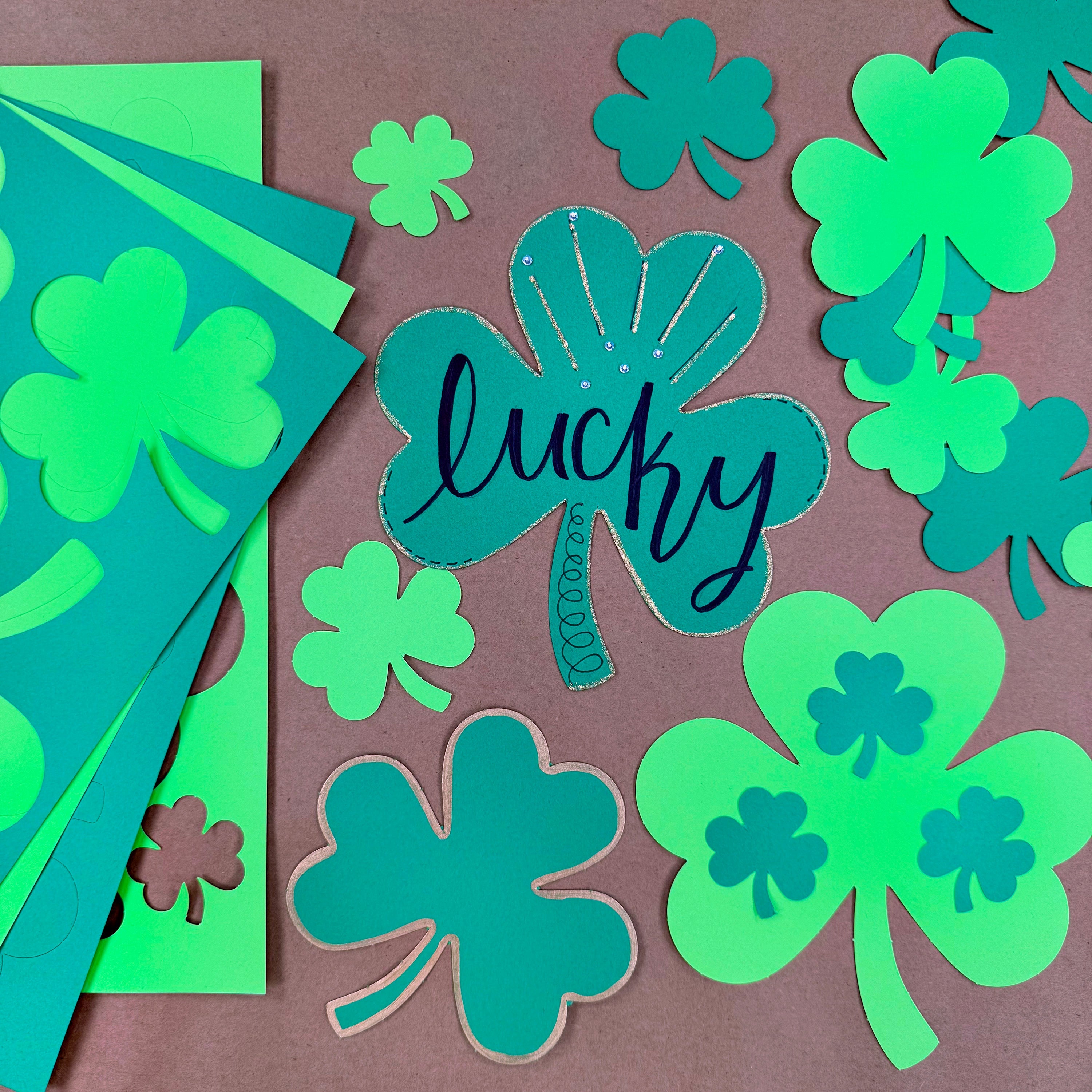 St. Patrick's Day decorations—shamrock cutouts ideal for spring crafts, St. Patrick's Day bulletin boards, and festive DIY activities.