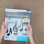 Musical notes and symbols—black paper shapes representing various music notes and symbols for creative projects and music education.